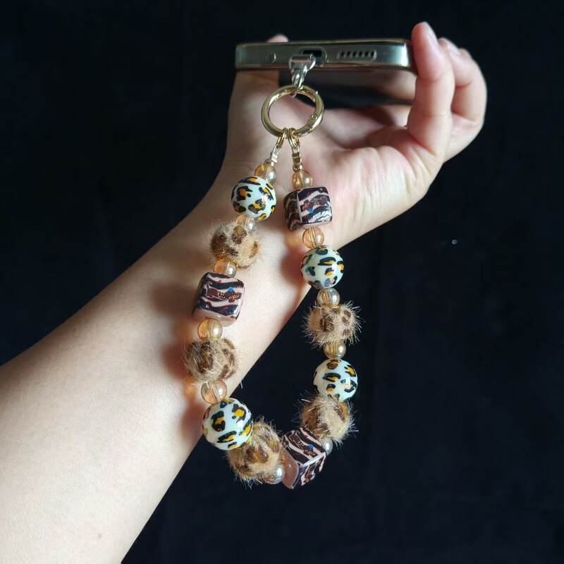 Autumn and winter leopard print pom-pom pendant, beaded bracelet, short wrist strap, phone case, car keychain, and bag charm