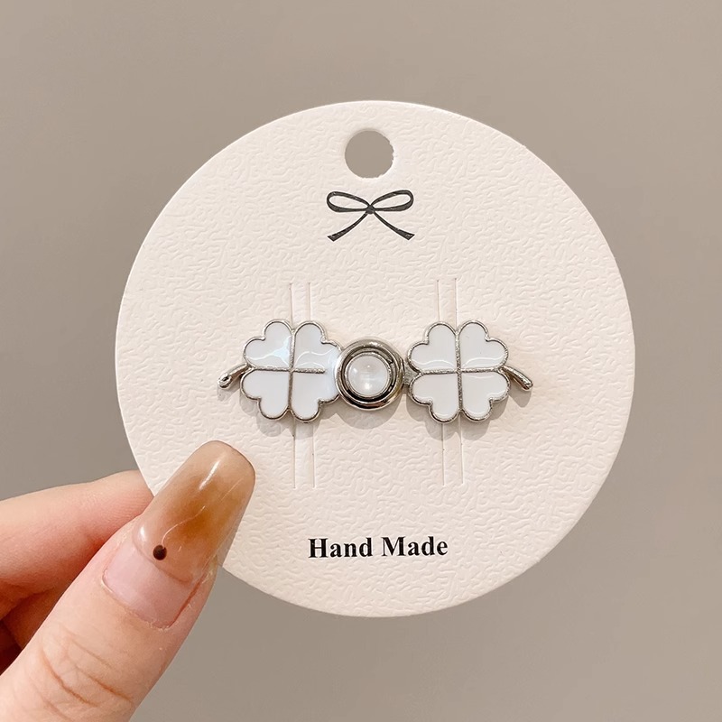 La cintura de los jeans se cambia a un botón de cintura pequeño, broche, falda de mujer, ajuste de cintura, dispositivo de ajuste, alfiler, botón anti-luz fijo