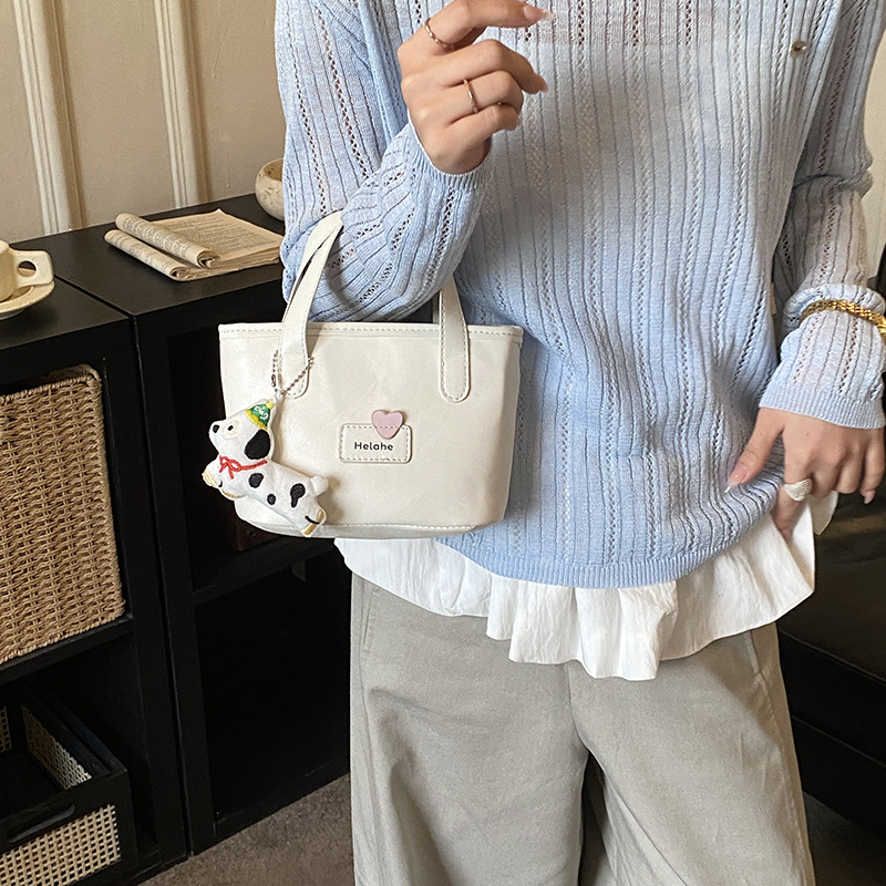 Bolso de moda coreano para niños y niñas simple color sólido pequeño y ligero bolso de cestas de bebés nuevos accesorios para niños bolso