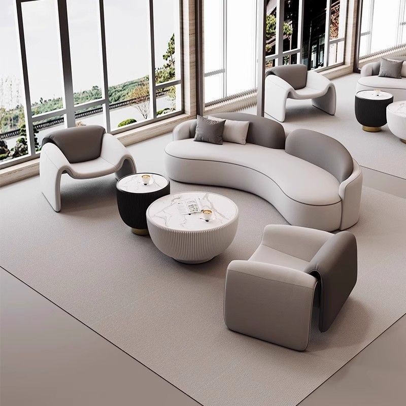 Light luxury modern minimalist curved sofa and coffee table set for commercial use in hotel lobbies, reception areas, meeting spaces, and beauty salons