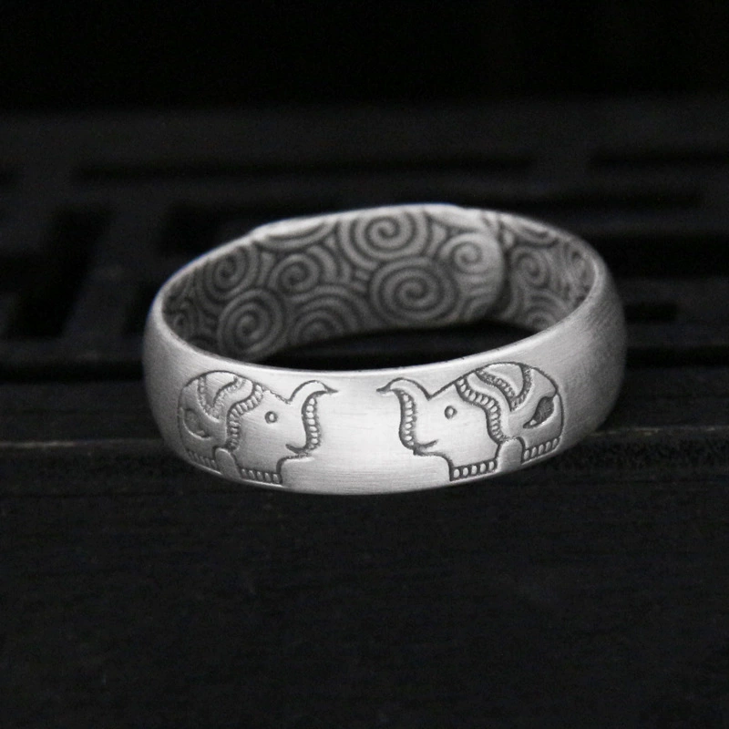 Silver bracelet, retro design ring, on index finger