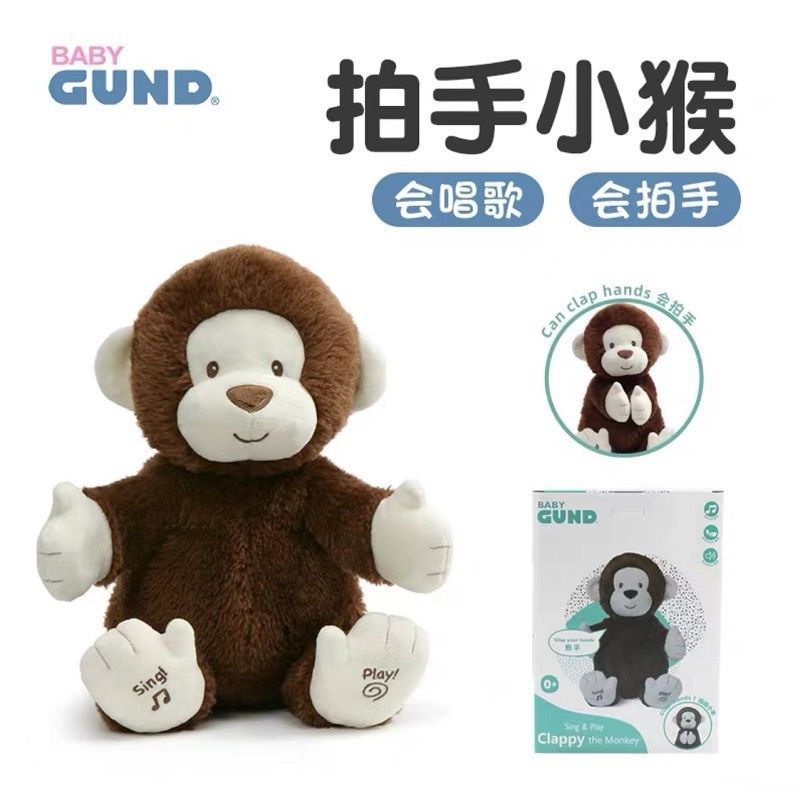 アメリカのbaby gundの誕生日熊熊の誕生日おめでとう歌はろうそくを吹いて赤ちゃんの子供のぬいぐるみをなだめる