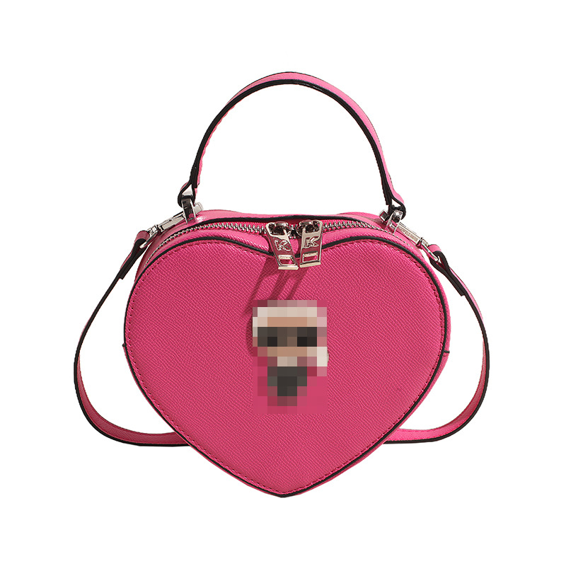 Bolsos transfronterizos para mujer 2024 nuevo bolso de hombro con diseño de corazón de nicho de moda bolso de mensajero portátil de amor de alta gama