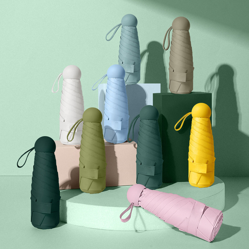 미니 휴대용 캡슐 우산 50% off 우산, 컴팩트한 블랙 플라스틱 자외선 차단 우산, 햇빛과 비 모두를 막아주는 우산