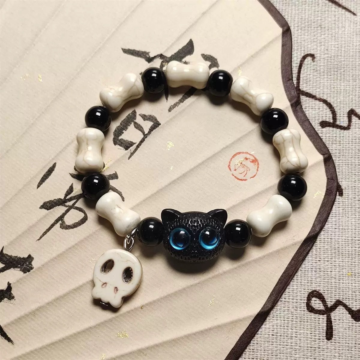 Esqueleto gato brazalete de cuerda trenzada nicho femenino diseño dulce y fresco chino ventanilla brazalete de color joyería