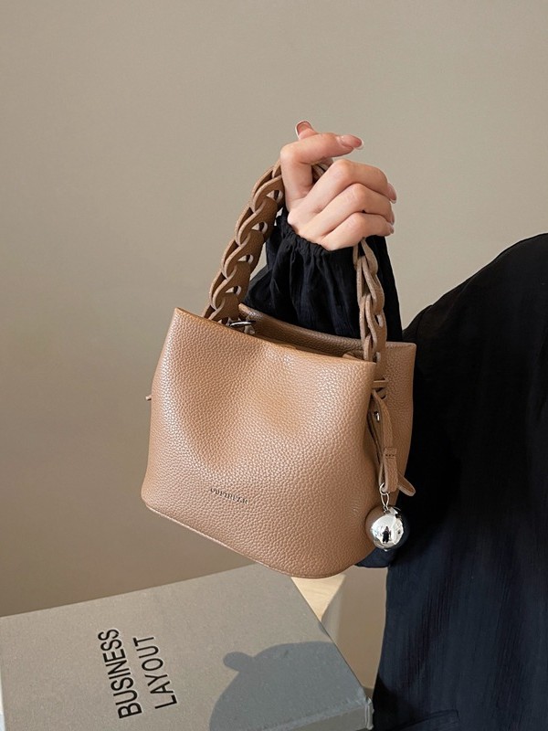 Bolso de mujer 2026 verano nuevo tejido a mano bolso de cubo de moda simple bolso de hombro mochila