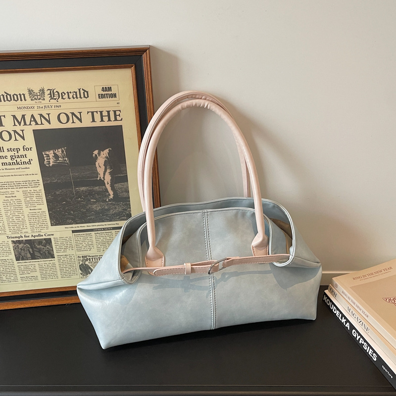 Bolsos de tendencia diaria coreana 2026 primavera nueva moda simple gran capacidad bolso de hombro bolso especial