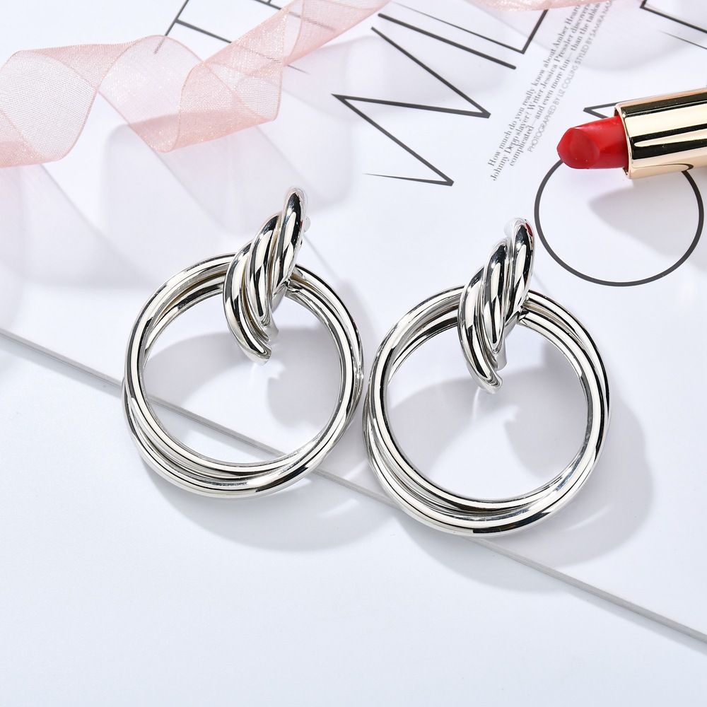 Women'S Gender Exaggerated Metal Knotted Twist Geometric Round Creative Earrings