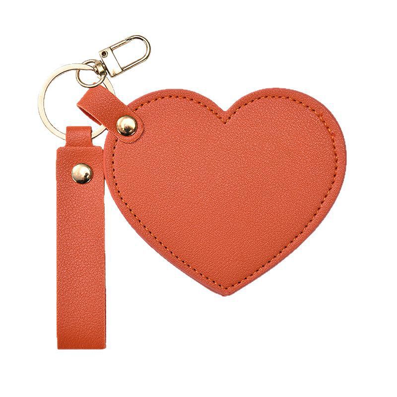 Espejo de maquillaje PU amor pequeño espejo de borde de aceite giratorio de moda red portátil espejo plegable de cuero espejo llavero