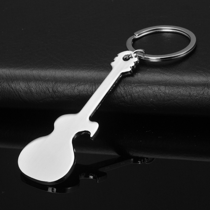 Creativo dientes de sable personalidad abertura de botellas lisa guitarra metálica tiburón llavero regalo para hombres colgantes al por mayor