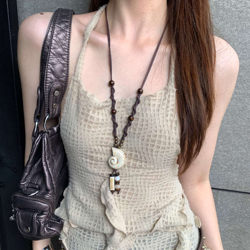 レトロなデザインの女性用ロングペンダントネックレス、ボヘミアンエスニックスタイルのビーズ鎖骨チェーン、積み重ねセーターチェーン|undefined