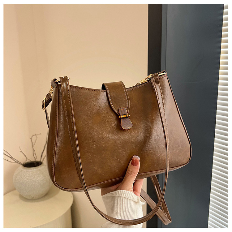 Nichezhong retro simple bolso de brazo bolso de mujer 2025 primavera nueva moda bolso pequeño de viaje de moda mochila de hombro