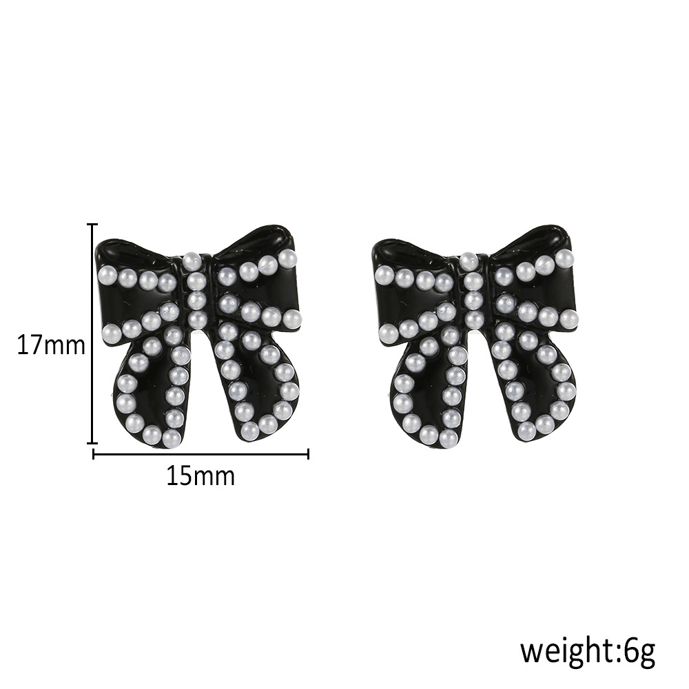 Korean Fashion Temperament Pearl Black Bow Earrings Autumn And Winter New Wild Earrings display picture 1