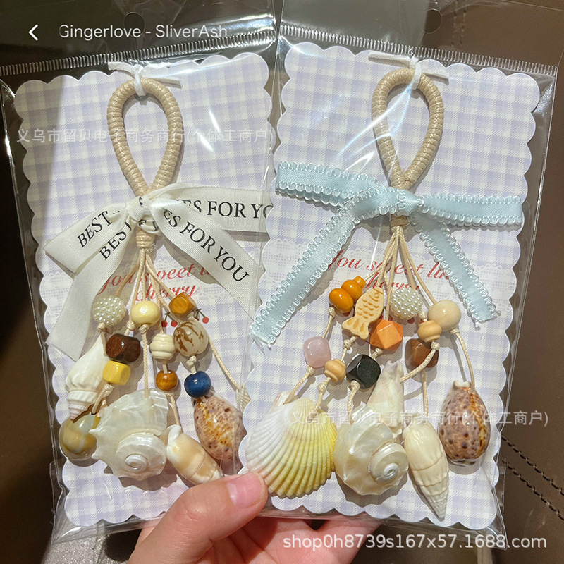 Natural seashell hand-cranked conch wind chime pendant, handmade ocean-themed home decor, creative travel souvenir and gift