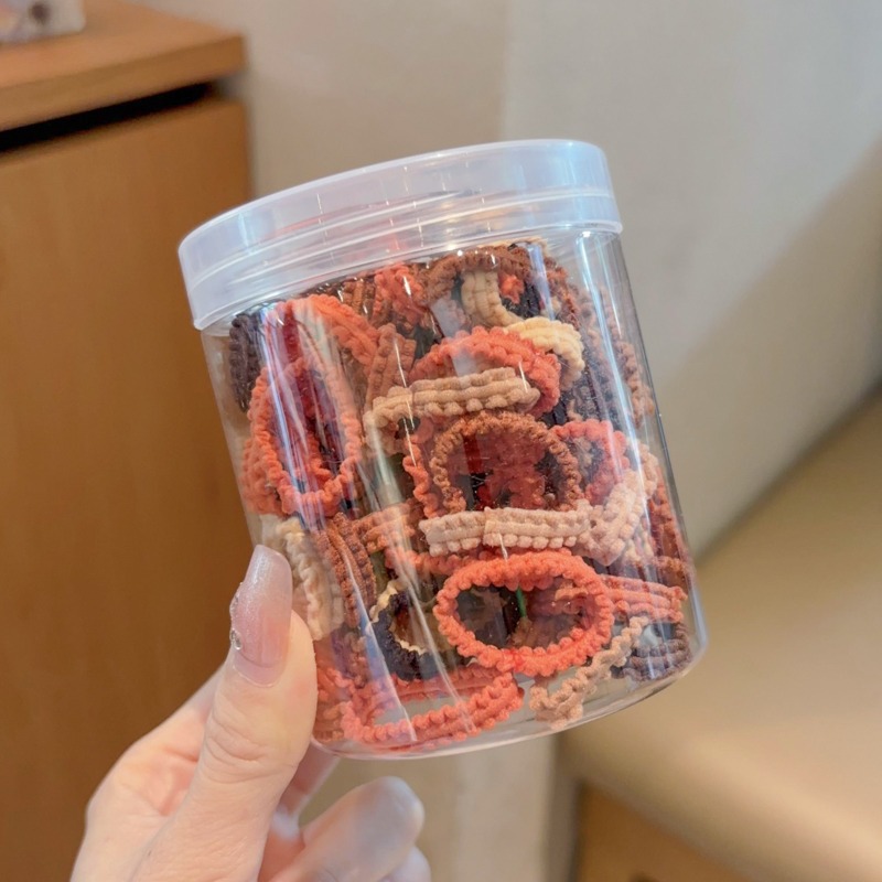 Las muchachas de la cuerda del pelo del color del caramelo no hacen daño al pelo pequeña tira de goma Lazo de la cuerda del pelo tocado niños lindos cubierta de cuero de la banda del pelo del bebé