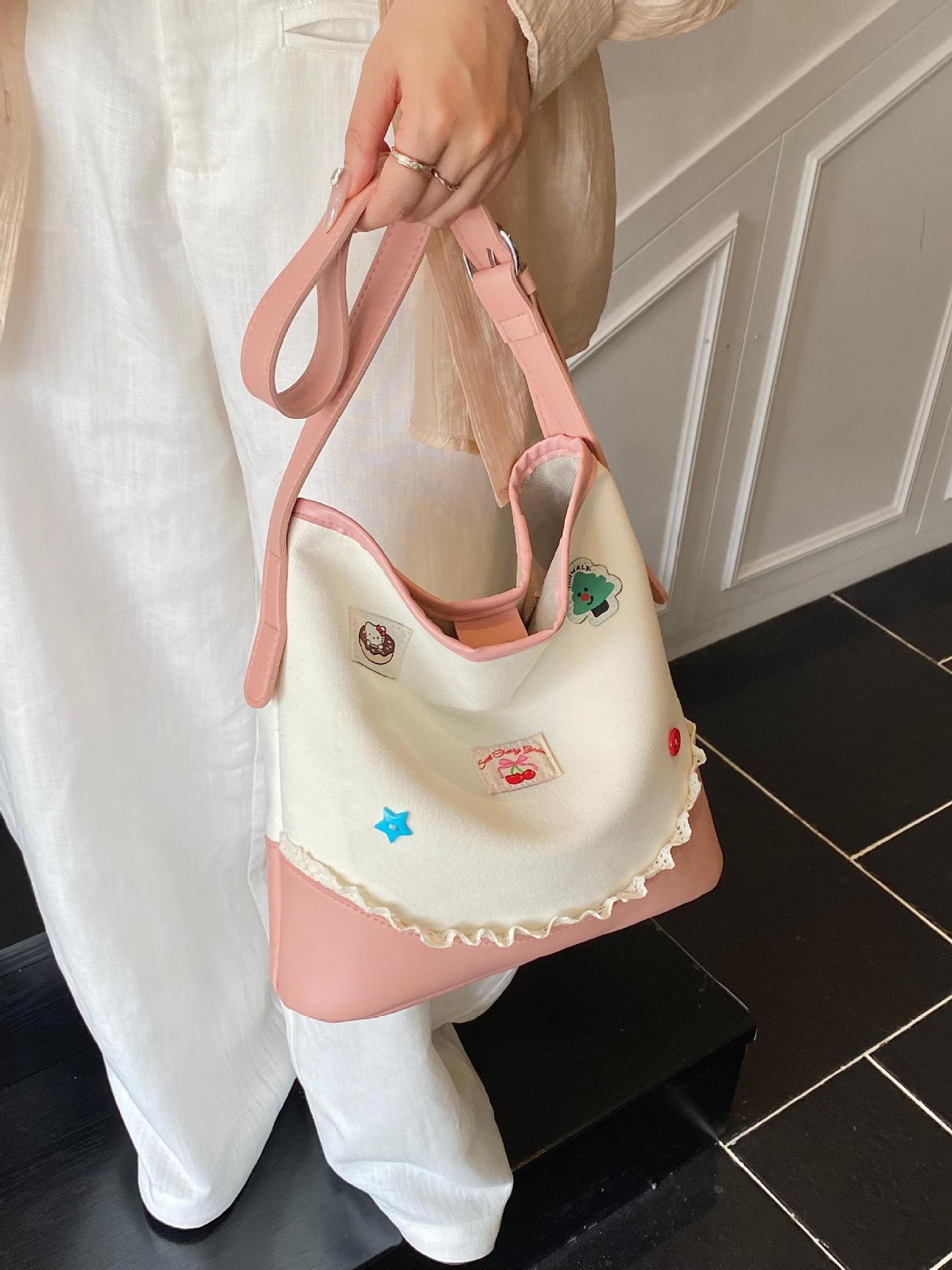 Bolso de cubo de ocio de color de contraste transfronterizo para mujer 2025 nuevo bolso de hombro de tendencia de moda salvaje bolso de mensajero de viaje de trabajo