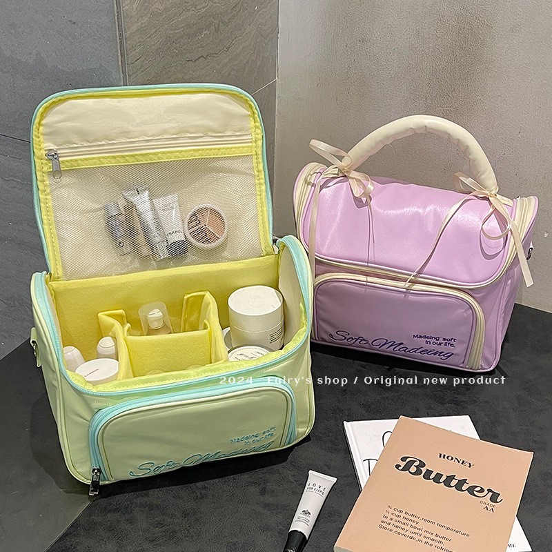 Handheld capacious cosmetic bag with bow to go out
