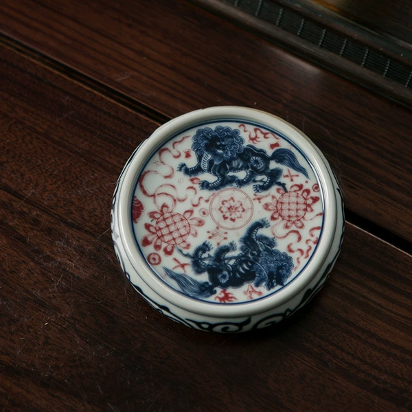 Porcelain clay covered lion with underglaze red