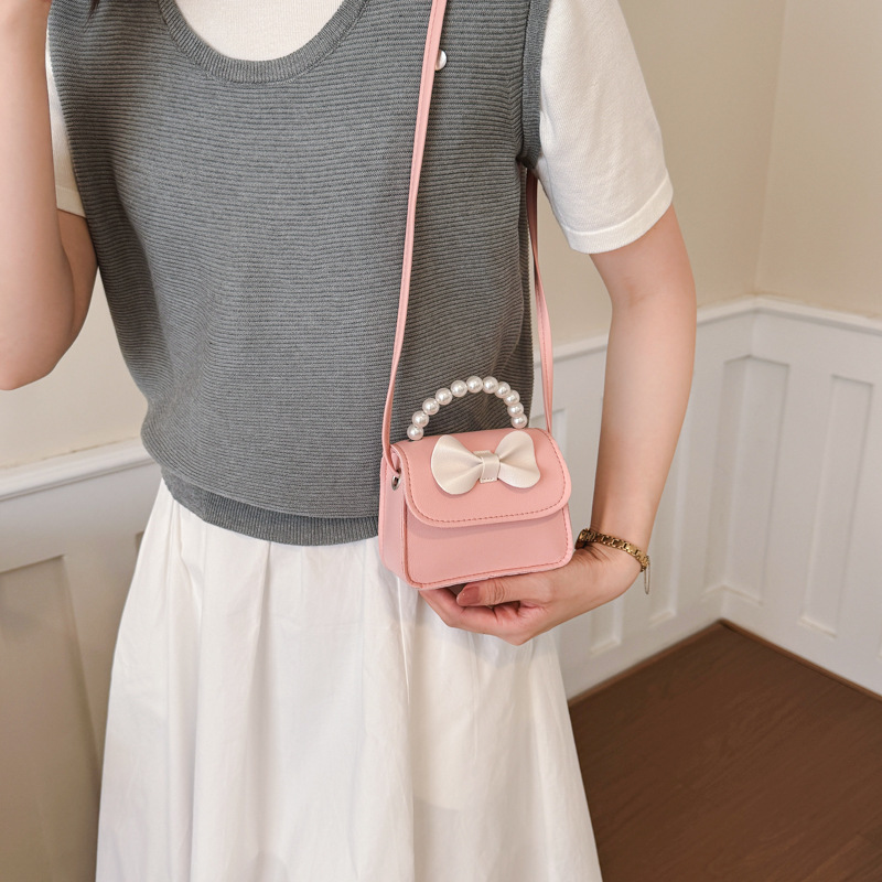 Bolsos para niños arco extranjero mini lindos bebés mochilas bolsos de perlas dulces bolsos de hombro para padres e hijos