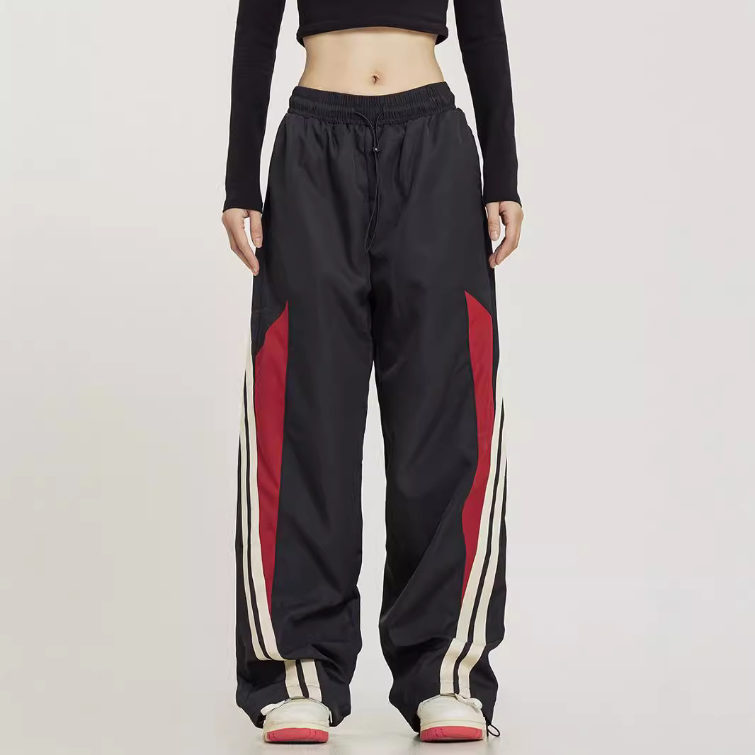 Pantalones deportivos a juego con rayas laterales de baile callejero retro americano para hombres y mujeres pantalones anchos sueltos rectos de primavera y otoño