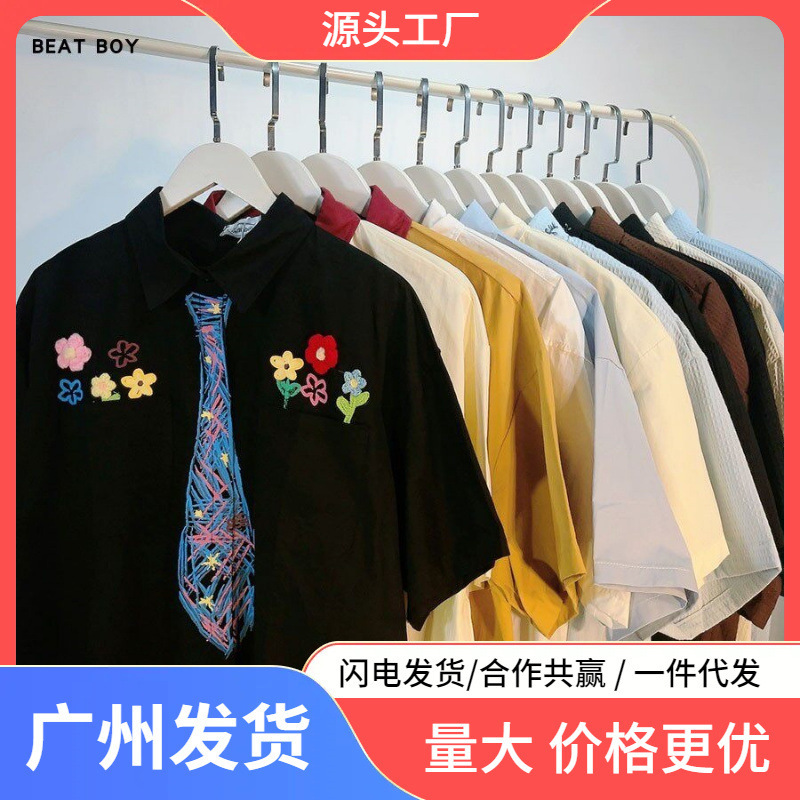 Dropshipping American-Style Hand-Painted Graffiti Shirts for Men and Women, Niche Trendy Brand Design Short-Sleeve Shirts with a College Style Floral Pattern