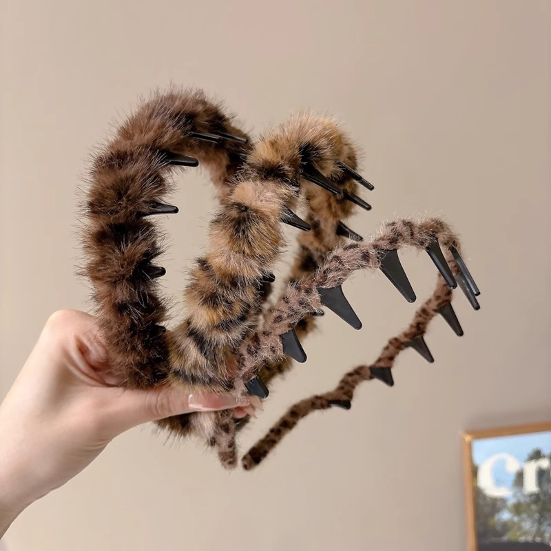 Temperamento coreano de leopardo ondulado banda de cabello mujer alta sensación de moda de presión de aire extranjera broca de cabello de peluche de otoño y invierno cabeza de cabeza alta