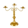 3 golden iron candlesticks