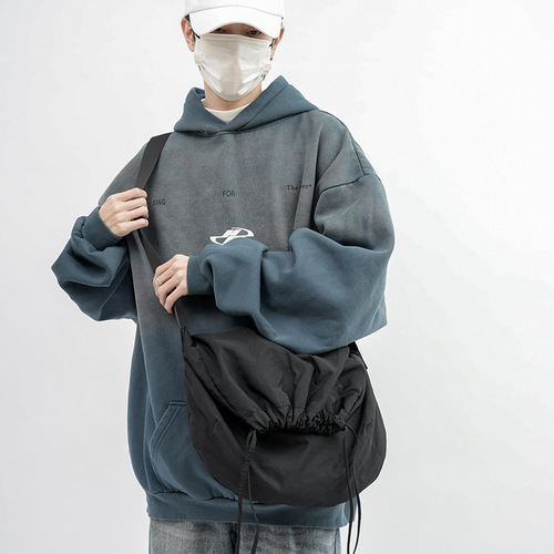 Minimalist drawstring bag for women, new solid color single-shoulder bag, Korean style retro tote bag, suitable for college students, hand-held and cross-body bag for men