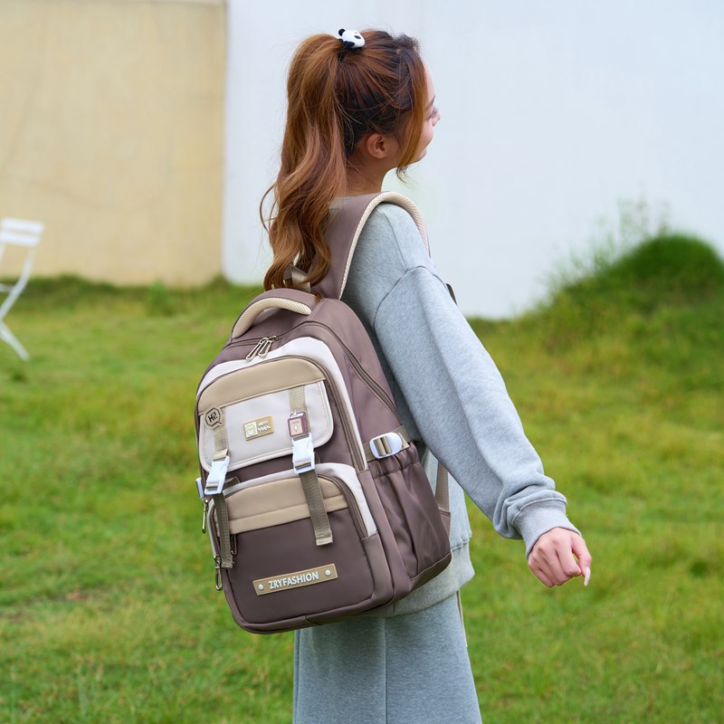 2025 pescado natural de alto valor de la cara mochila de alta capacidad multicapa de estudiantes de secundaria y secundaria simple y versátil