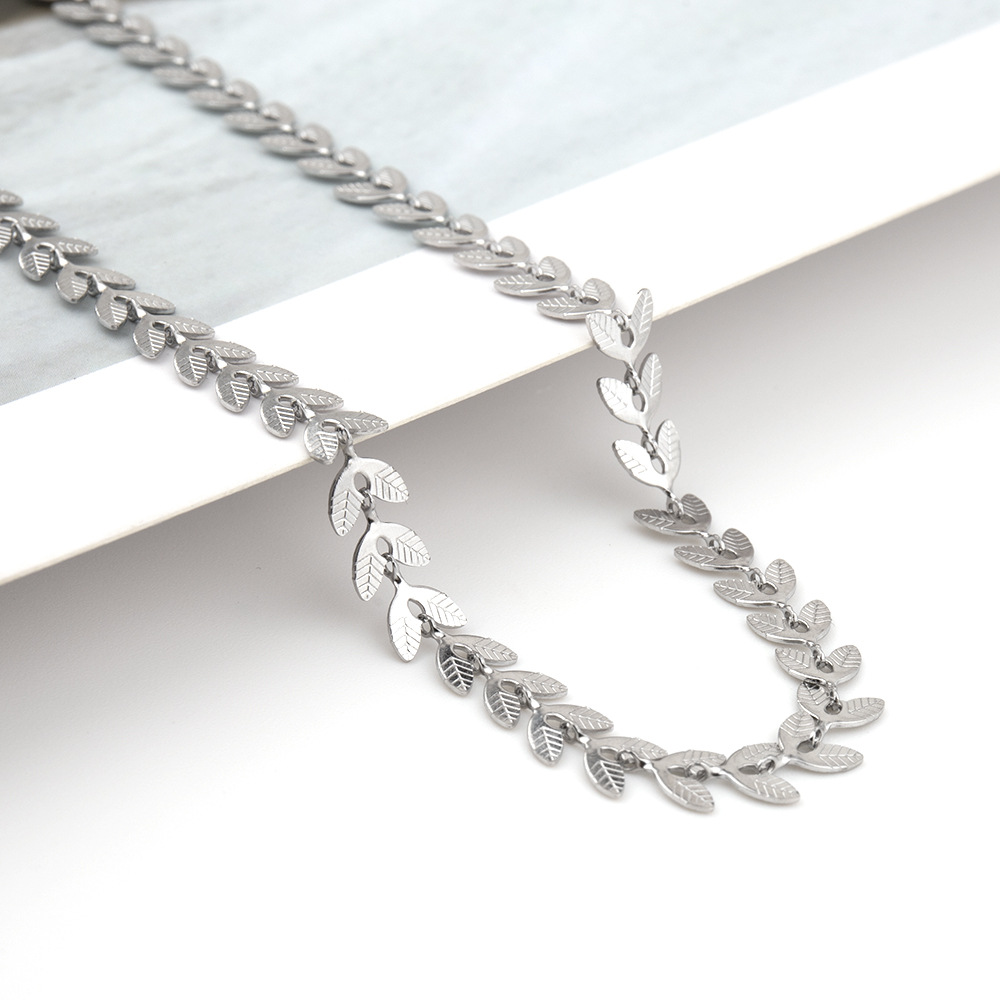 Titanium steel fresh simple double-sided patterned leaves, willow leaf hollowed out aircraft necklace, and versatile_voghion.com