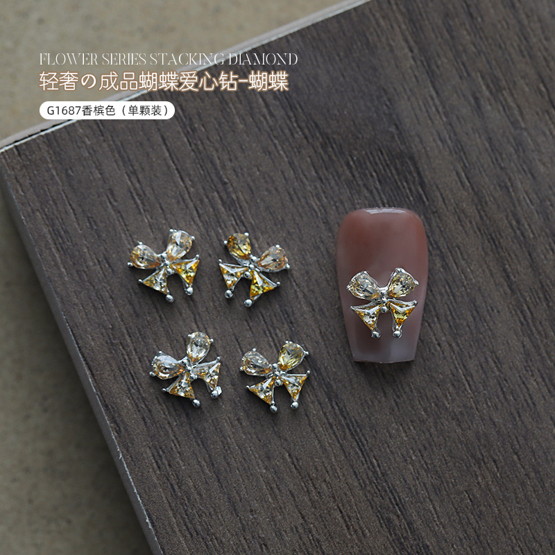 Love bowknot aleación manicura pila de diamantes productos terminados celebridades de Internet nuevas decoraciones de uñas de diamantes de pila súper flash al por mayor
