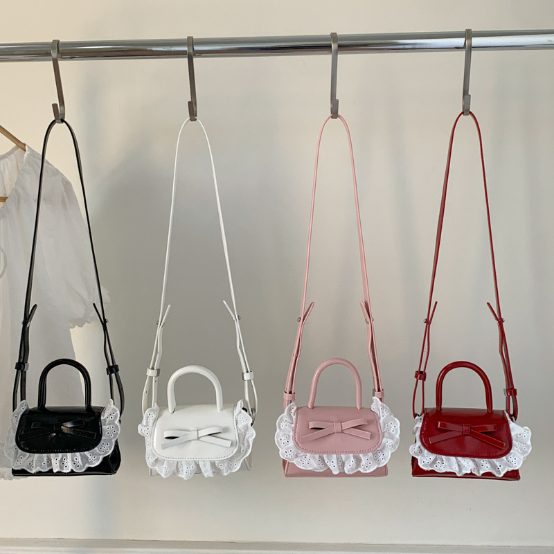Mini bolso para mujeres nuevo lindo arco PU inclinado a través de bolsos pequeños bolsos de lápiz labial para niñas accesorios bolsos de moda para niños