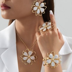 越境してよく売れている新型の油を垂らして優雅で甘いハスの花の二重の透かし彫りの立体の花の指輪のブレスレットのピアスのネックレス