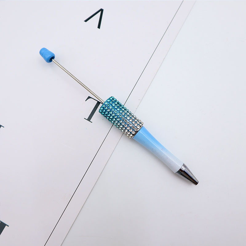 Bolígrafo giratorio de grano lindo de color degradado de tendencia de alto valor Bolígrafo de gomas galvanizado con cuentas de diamantes de bricolaje creativo