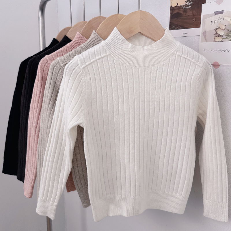 Suéter para niñas 2025 principios de otoño nuevo estilo blusa de bebé camisa de fondo invierno cálido suéter de punto para niños de cuello medio alto