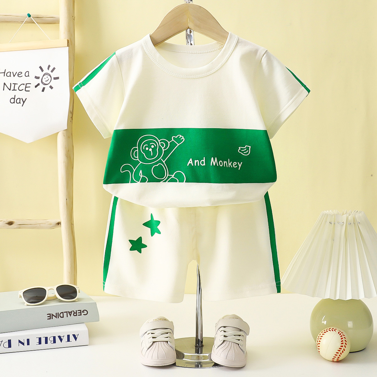 Verano para niños nuevo estilo traje de manga corta camiseta a rayas para niñas y niños ropa de bebé suelta y transpirable al por mayor