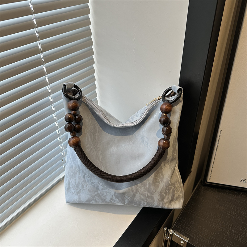 Nuevo estilo chino diseño de bolso de hombro mujer 2024 verano nuevo estilo de moda gran capacidad alta sensación de mochila
