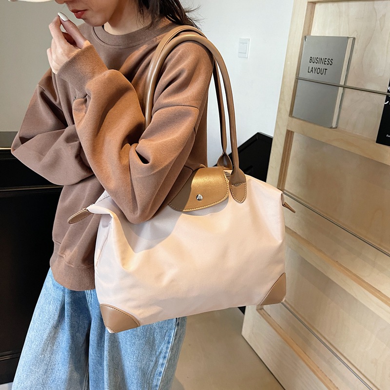 Bolsas de viaje transfronterizas de gran capacidad de sensación de alto nivel bolsas de bolsas de bolsas de alojamiento en espera de producción bolsa de almacenamiento de acondicionamiento físico bolsas portátiles al por mayor