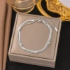 Blade, round beads, steel bracelet