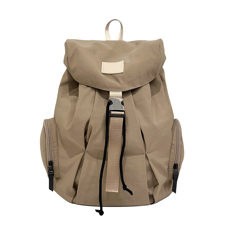 Mochila de nylon de color sólido coreano a prueba de agua de gran capacidad para parejas de viajes casuales ultraligero mochila de moda cool