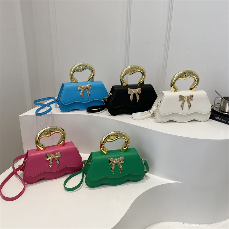 Bolso de arco ondulado damas 2024 nuevo otoño invierno bolso de hombro color caramelo estilo extranjero bolso de mochila elegante
