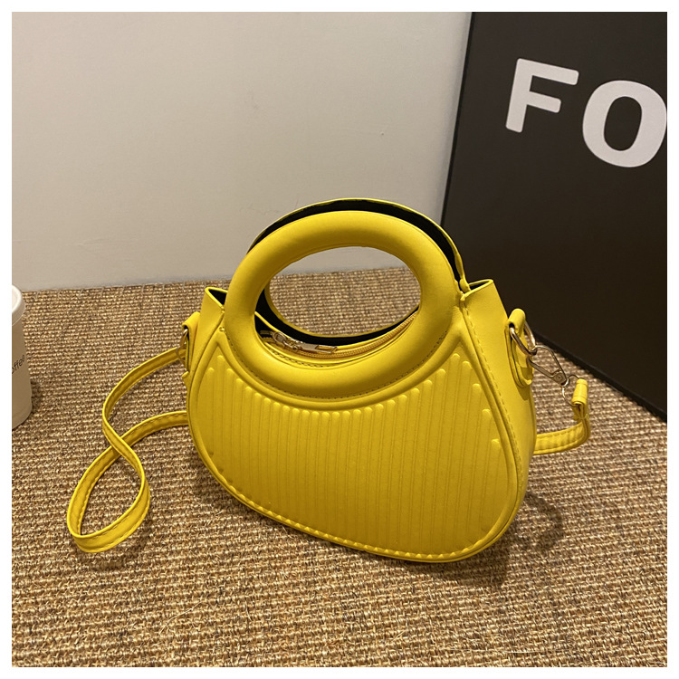 Fresco dulce dopamina color sólido rayas bolso de las mujeres este año popular pu estilo occidental bolso de hombro redondo