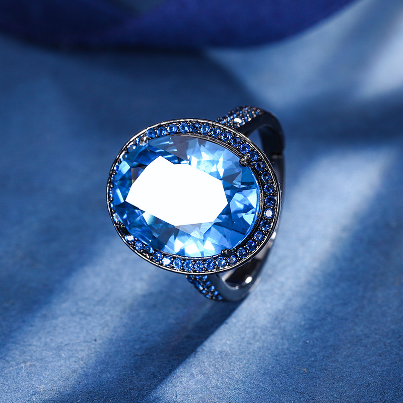 2024 nuevo Zhuang Sheng joyería fondo de cobre chapado en oro simulación azul puntiagudo cristal negro oro personalidad traje 13*18-12*16