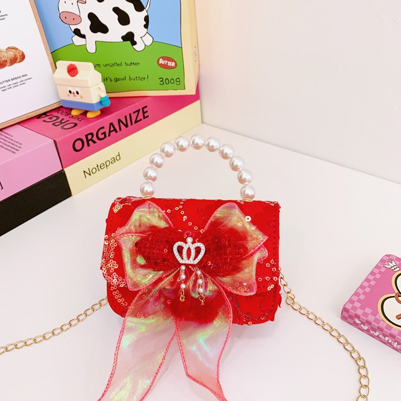 Nuevo bolso de hombro de niñas lindo arco bolso de perla bebé 2025 bolso rojo pequeño viento perfumado bolso para niños