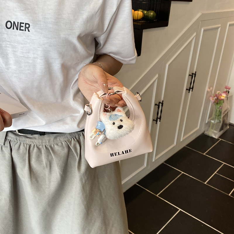Alto valor facial con colgantes bolsas de hombro para niños y niñas mini bolsas de mano lindas para bebés letras extranjeras bolsas de accesorios para niños