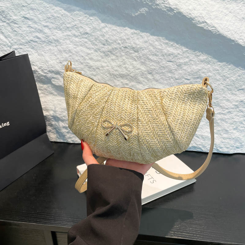 Bolsos tejidos de diseño de nicho para mujer 2025 verano nueva textura comercio exterior casual moda un hombro axila bolsa de bola de masa