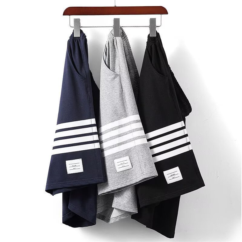 Pantalones de hombre de verano nuevos pantalones de hombre casuales transpirables pantalones cortos delgados marca de moda de tamaño grande suelto cuatro barras deportivas