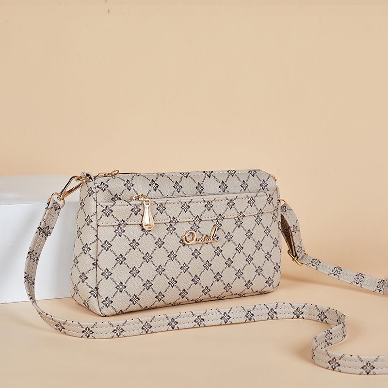 Guangzhou Hengli 2024 nuevo bolso de mensajero transfronterizo bolso casual de mediana edad bolso de teléfono móvil para mujer bolso de venta caliente bolso de hombro