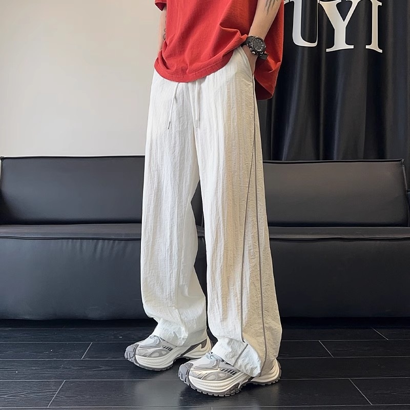 Pantalones blancos de línea clara para hombres de verano delgados pantalones deportivos de pierna ancha de marca de moda pantalones casuales de hombre rectos sueltos