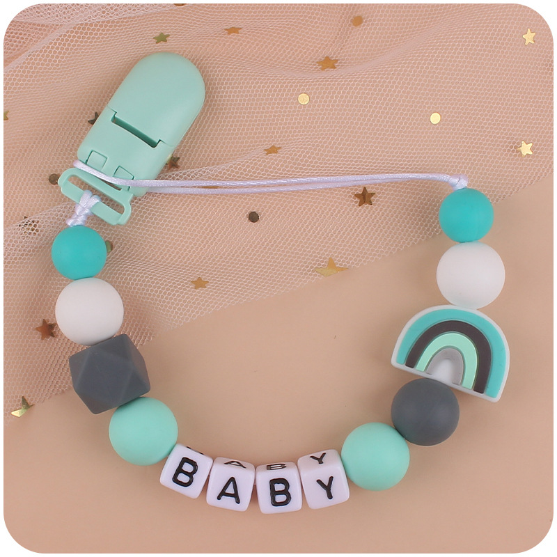 Nuevos suministros para bebés chupete Cadena de dibujos animados lindo arco iris de silicona pequeña cadena anti-caída mordedor